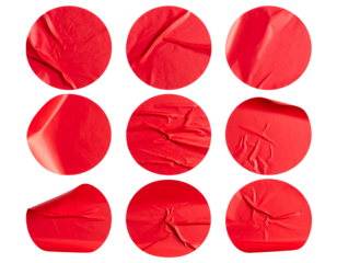 Nine vibrant, textured red circular stickers arranged on a black background, creating dynamic wrinkles