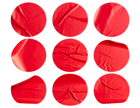 Nine vibrant, textured red circular stickers arranged on a black background, creating dynamic wrinkles - Powered by Adobe