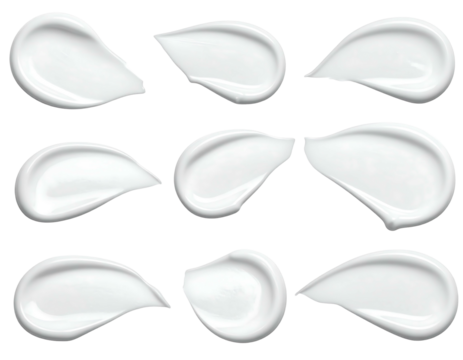 Nine white cream smears, arranged in rows, on a solid black backdrop