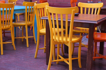 Colorful chairs and tables in a cozy cafe setting