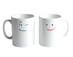 Two white mugs, each with a simple cartoon face, isolated on black, one winking, the other smiling
