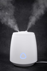 Air Humidifier with Steam on Black Background