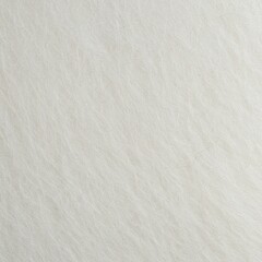 Obraz premium Macro detail of pure white felt fabric, showcasing the soft, dense, fibrous texture ideal for winter comfort and crafts ,blanket ,textile ,fluffy