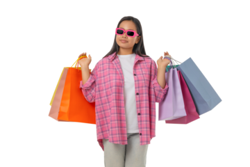 Young woman carries vibrant shopping bags, isolated on white, PNG