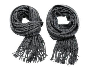 Two gray knitted scarves, with fringed ends, are arranged side-by-side on a dark, near-black background