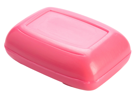 Rectangular pink soap bar casting a shadow, atop a black background