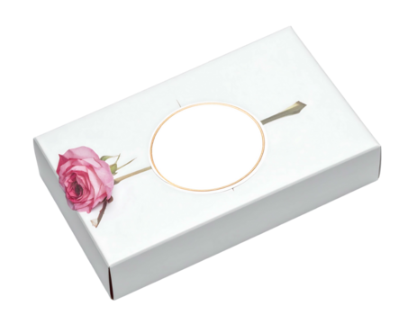 Rectangular white box with a pink rose and gold-rimmed circle, angled on a black background - Powered by Adobe