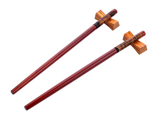Pair of red wooden chopsticks resting on small, light-colored wooden holders on a solid black background