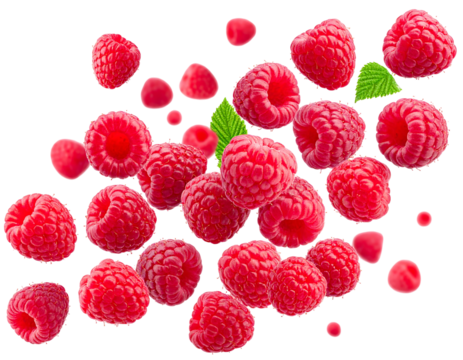 Scattered ripe raspberries and bits with green leaves on a stark black backdrop. A vibrant, delicious presentation