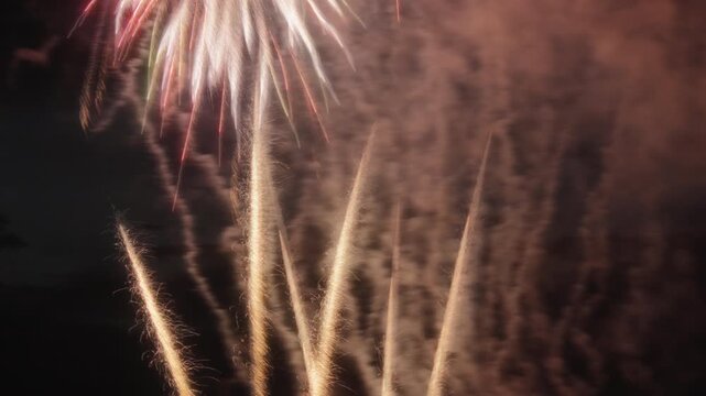 Abstract close up of exploding festive fireworks at night. Long exposure