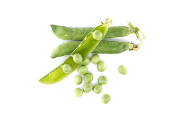 An overhead view showcases vibrant green peas and open pods on white surface, ready to be harvested