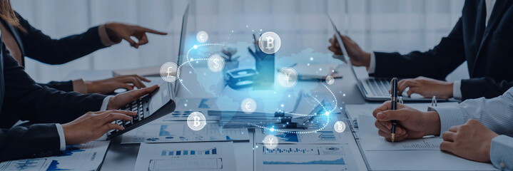 Business professionals actively engage in a meeting focused on cryptocurrency trends, utilizing technology and data to drive financial strategy and innovation. Trope