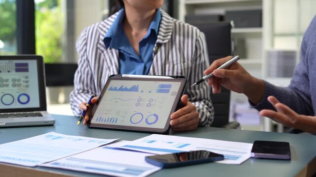 Project manager working and update tasks with milestones progress planning and professional investor working new start up project in the office.