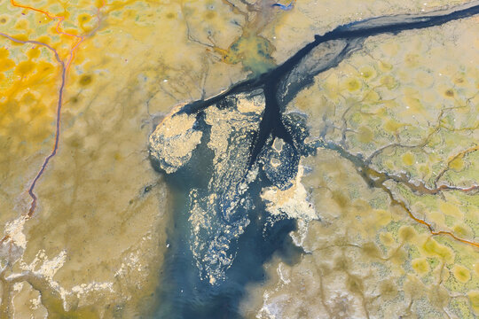 Fototapeta Emission of pollution by sewage from the city fall into the lake,Water pollution, environmental problems.