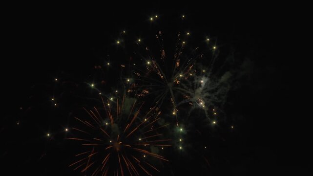 Fireworks exploding in the sky during a celebration. Slow motion