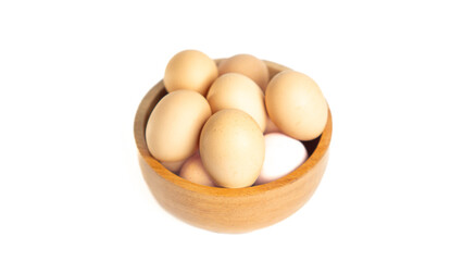 Chicken eggs on the wooden bowl. Isolated eggs on white background