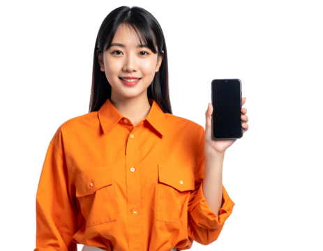 Smiling young Asian woman in orange shirt presents a phone with a blank screen on a dark background