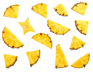 Sliced pineapple pieces and one starfruit section on black, highlighting fruit's texture and vibrant yellow hue