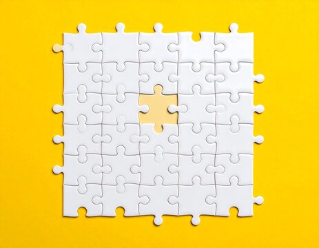 A jigsaw puzzle on a bright yellow background, missing a central piece