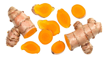 Two whole turmeric rhizomes with several bright orange, sliced cross-sections scattered across a black background
