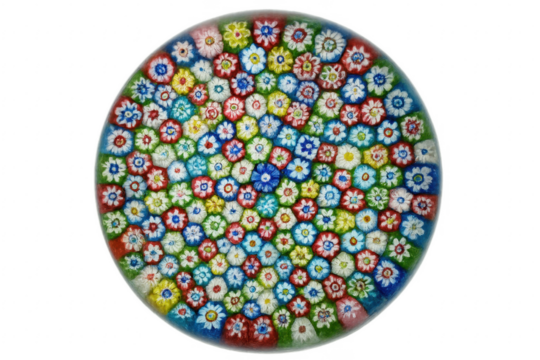 Round Murano glass paperweight displaying intricate colorful flower patterns