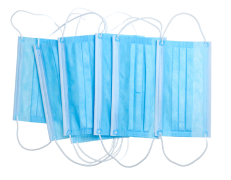 Stacked light blue surgical masks isolated on black. Protective gear with white elastic ear loops
