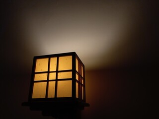Aesthetic yellow box lamp mounted on the wall as a night light