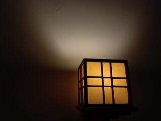 Aesthetic yellow box lamp mounted on the wall as a night light