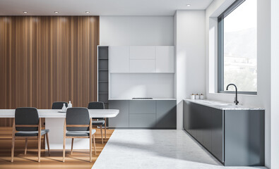 Sleek modern kitchen and dining room interior with gray cabinetry, wood panel wall, minimal décor and large window in daylight concept. 3D Rendering