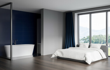 Contemporary interior showing a minimalist bedroom with white bed, freestanding bathtub, blue curtain, large window, and wood flooring. 3D Rendering