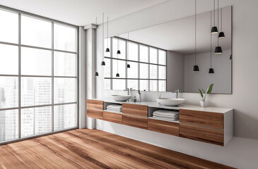 Minimalist bathroom interior with wood cabinets, vessel sinks, and large mirror, featuring pendant lights and cityscape window background. 3D Rendering