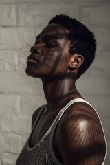Artistic portrait of a serene young woman standing by a brick wall in soft sunlight, with gentle shadows highlighting her natural beauty, elegance, and introspective mood in minimal warm tones