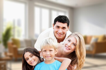 Obraz premium Happy young family with children having fun at home.
