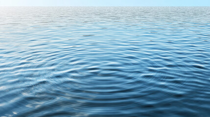 Gentle ripples on serene blue water surface create calming atmosphere