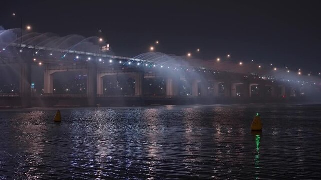 Banpo Bridge rainbow fountain spraying water illuminated by colorful lights over the Han river