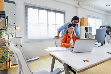 Business Professionals Discussing Project in Modern Office