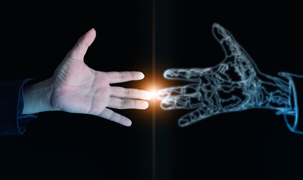 Human hand reaching toward digital twin hand glowing with energy light, symbolizing human-AI connection, innovation, and the merging of technology with emotion in digital transformation.