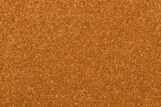 copper color glitter texture ideal as a brilliant shining background for metal