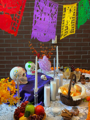 Colorful Altar Setup for Day of the Dead Celebration Featuring Traditional Offerings and Decorations