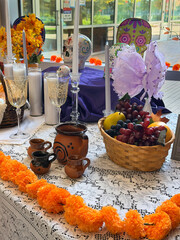 Colorful Altar Display for a Cultural Celebration Featuring Fruits, Flowers, and Decorative...