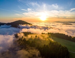 Aerial landscape of rolling hills and cloud cover at golden hour