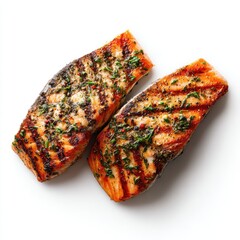 Two grilled salmon fillets, seasoned and ready to eat