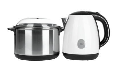 Pair of compact electric egg boilers with stainless steel bases, isolated on transparent background