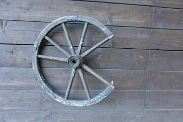 old wooden wheel on the wall