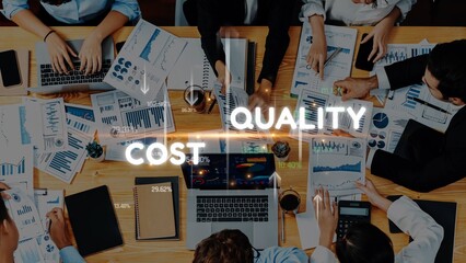 A collaborative office scene showcasing professionals engaged in strategic discussion around...