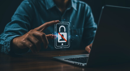 A person holding a mobile phone with lock symbol is on laptop. Conceptualizing digital security and data protection.