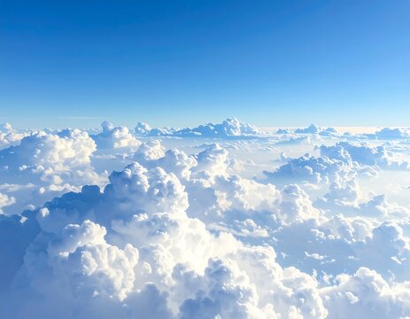 Aerial view of a bright blue sky filled with fluffy white clouds - Powered by Adobe