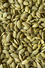 Green pumpkin seeds background