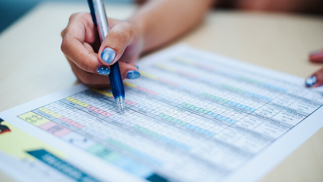 Analyzing data sheets office business document review indoor close-up efficiency in work