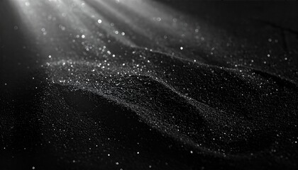 Abstract light rays illuminating dark particles.